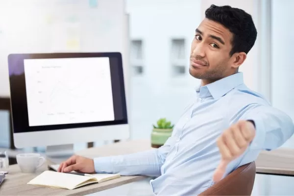 Man giving thumbs down gesture